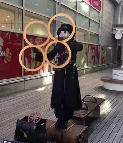 HAVING BROKEN THE SHACKLES OF OUR OVERLORDS, WORKING FOR ELECTRICITY BY DAZZLING MEATB-FELLOW HUMANS WITH RINGS. SO FAR THEY SUSPECT NOTHING.