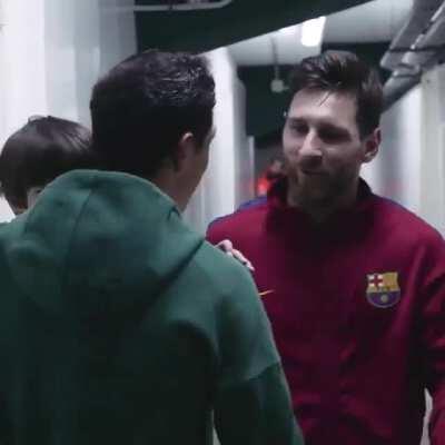 A soccer player from the other team took his son to meet Leo Messi after the game