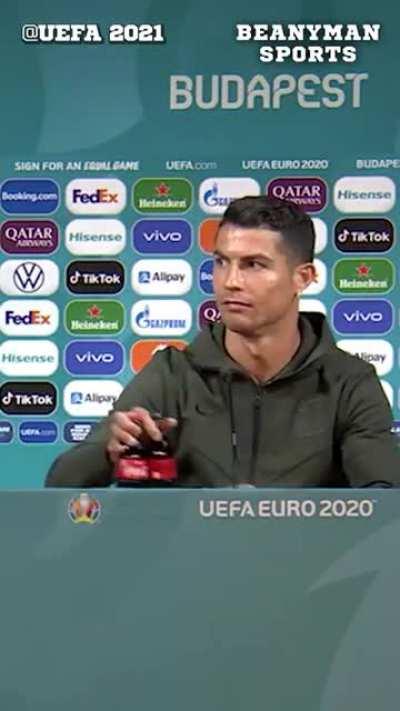 Ronaldo removing Euro 2020 sponsor Coca-Cola bottles in front of him before his press conference, adding 'Drink water!' instead