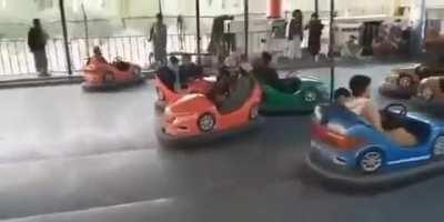 The Taliban driving bumper cars in a theme park in Kabul