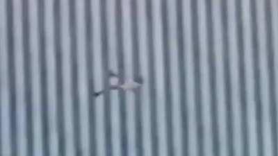 Possibly the clearest and most disturbing video of a 9/11 jumper victim falling (video stabilized)