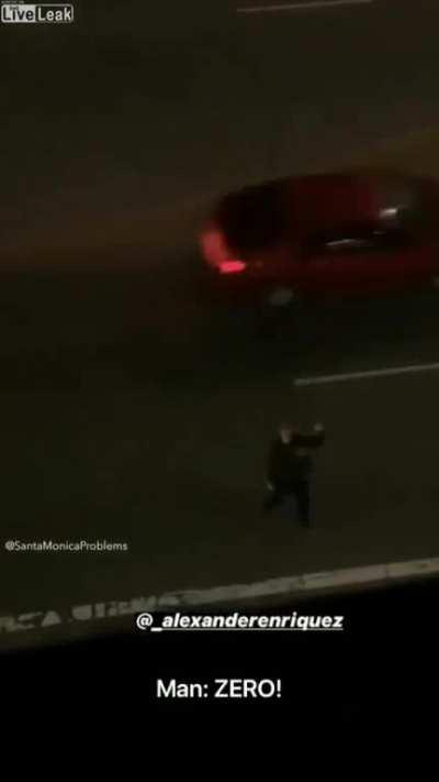 Man on road threatening a building gets hit by a car