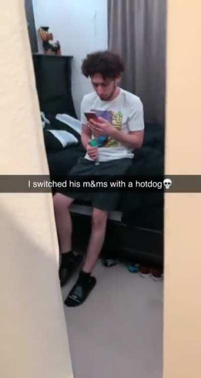 Guy switches his friends m&ms out for a hotdog