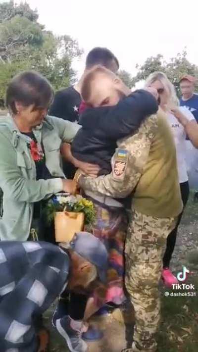 When your grandson returns from the front. A babushka must hug him.