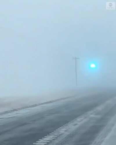 Cellphone footage shows power lines flashing as blizzard sweeps through Minnesota