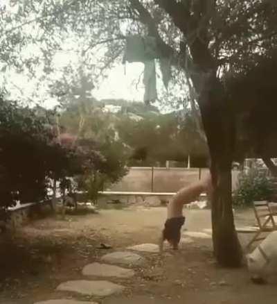 to please the lady after a failed handstand attempt.