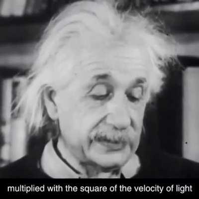 Einstein explaining his famous formula E= mc^2