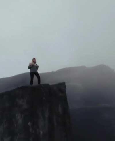 Amazing camerawork circling edge of cliff