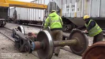 Railway lifting jack used to replace railcar steel wheels due to defects and flat spots