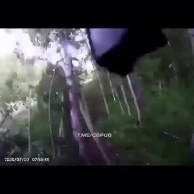 Man tries to fix bag in passenger seat. Forgets about the whole driving thing.