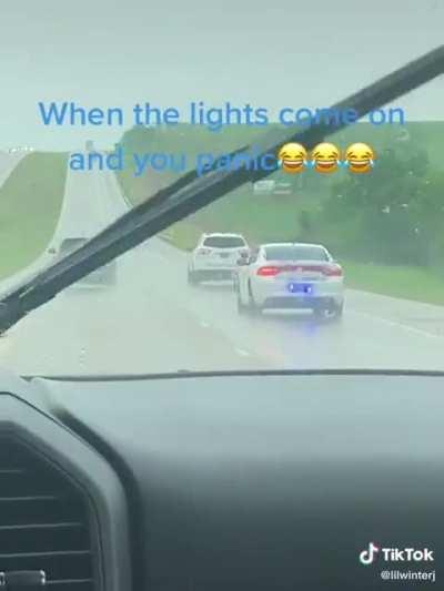 Why is this cop trying to stand in the rain anyway?