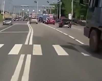 Russian truck stopping at a green light