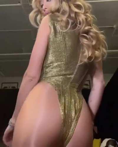 Showing off the back of her outfit