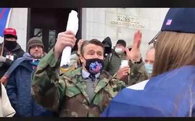 Republican Senator Todd Young arguing with Trump supporters at DC protest