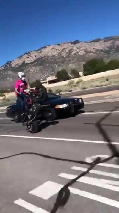 Cop pulls gun on biker for wheelies