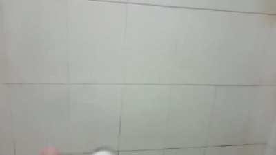 Guy plays mission impossible theme on shower hose