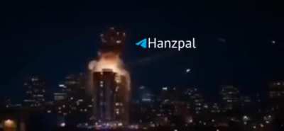 Iranian missile detonates on roof of high rise residential building, sheers off half of structure