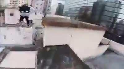 Catching some cool shots while himself doing hardcore parkour