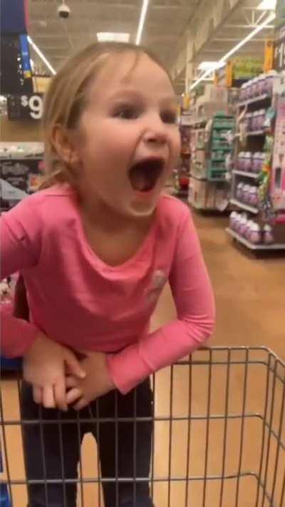 Little girl was excited to get a toy.