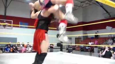 Queen Erica gives Mickie James a backbreaker