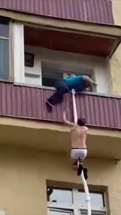 The blue T-SHIRT man is getting annoyed with the man..