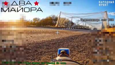 70th Division Fiber-Optics FPV drone lying in ambush strikes UAF armored recovery vehicle as it exits the anti-drone 