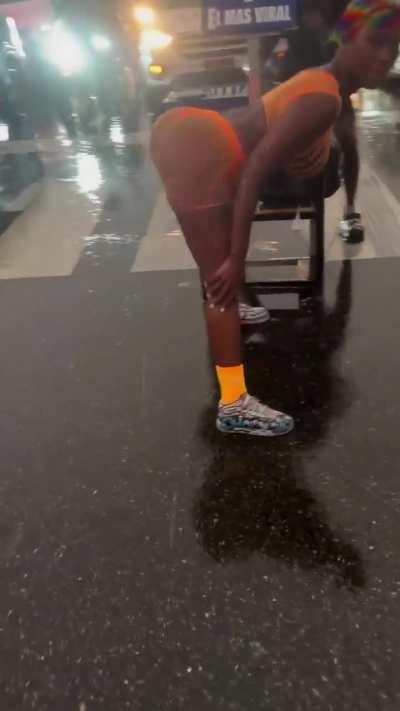 twerking in the middle of the street while it's raining