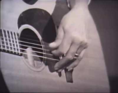 Elizabeth Cotten’s namesake style of play was formed by left-handedness & the banjo. After marriage, she closeted her guitar for over 30 years until fortuitously becoming housekeeper to the Seeger family. Here, c. 1960s, she performs the folk standard
