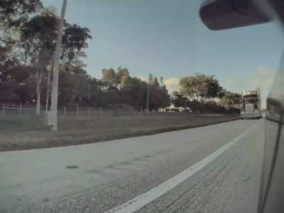 Road rage trucker purposely rides in emergency shoulder and attempts to smash into car— FL Turnpike
