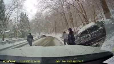 EMS standing in the middle of an icy road