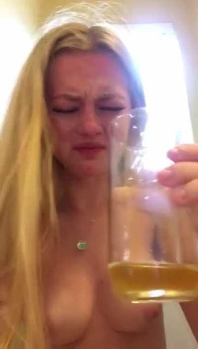 Failed attempt to drink her own pee