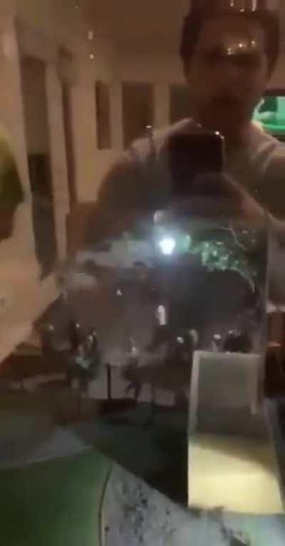 BLM supporter in 2nd-storey window gives thumbs up to BLM street protestors. The BLM street protestors immediately break his windows.