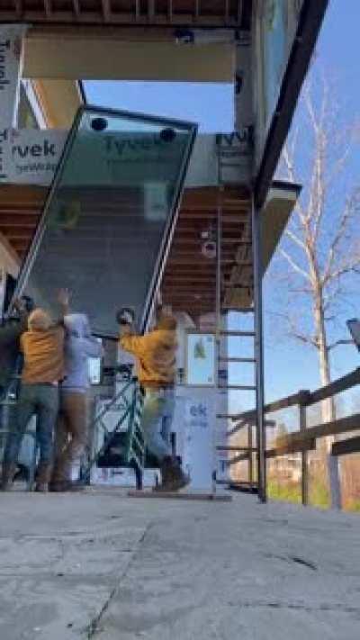 Surely 4 guys can lift a window in place? Right? Um, guys?