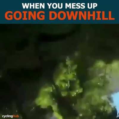 Speeding down a hill on a bike.