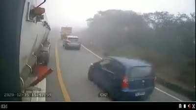 Idiot trying to pass some cars