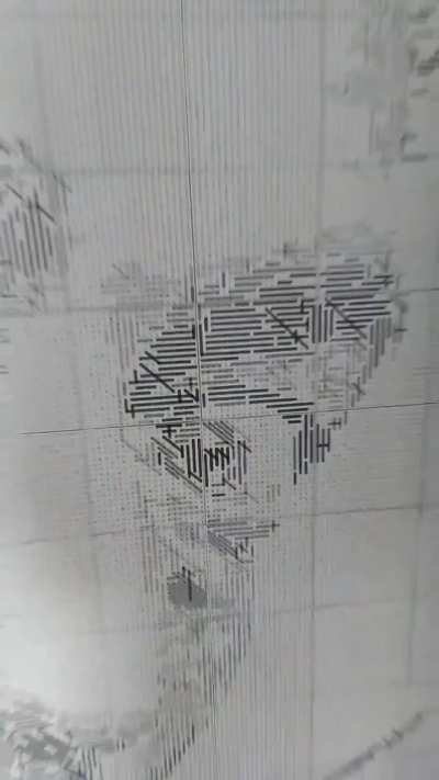 Salvador Dali portrait made with a 60.000 letter grid on word search puzzles and approx 5500 words solved with watercolor markers