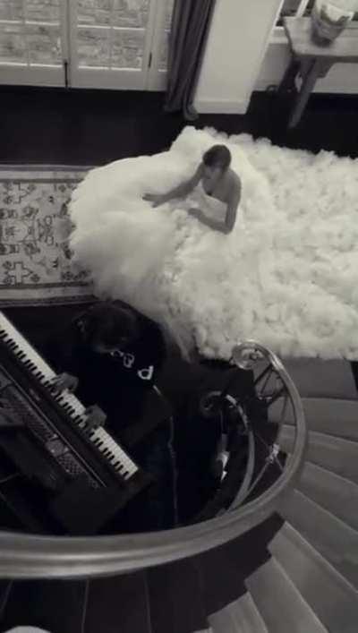 taylor performing champagne problems while in a wedding dress😓