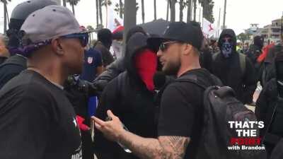 Journalist faces off with mob