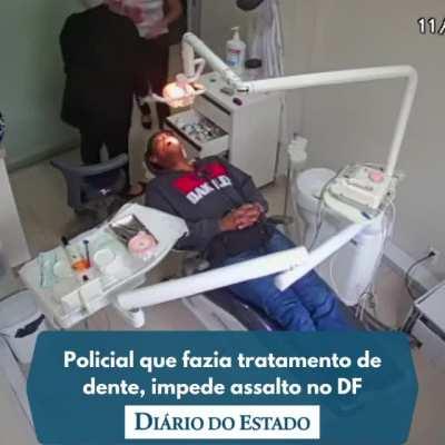 [Brazil] Police officer reacts to robbery during dental care.
