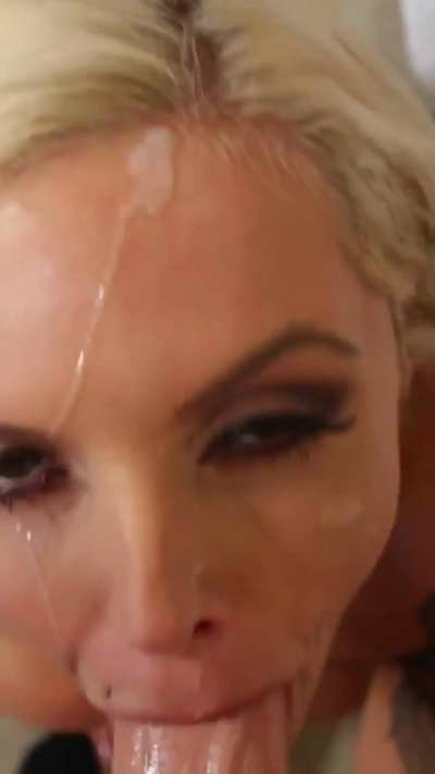 Nina Elle enjoys your cum on her face.