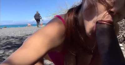 Naughty blowjob on public beach