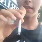 Trying to smoke with an ice cream cone holding the cigarette.