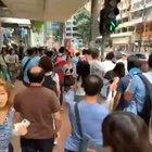 Men in blue (blue: supports HK police) attacks a non-protesting youngster, with Chinese national flags in Hong Kong. (Dress code for protestors is black)