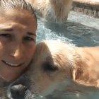 Blowing bubbles with her dog