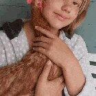 Happy pet chicken being cuddled