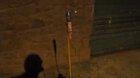 Some dude launches a firework and hits a building with it
