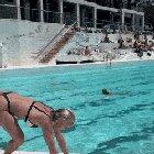 CrossFit girl hanging by the pool.