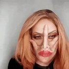 Girl putting up make up before going out Saturday night