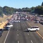 Idiots block busy interstate in California to do donuts.