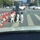 Here let me record a family crossing the road